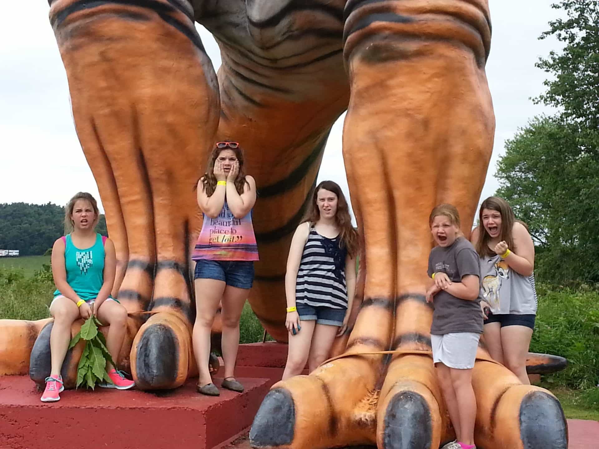 Dinosaur World posing with the giant T-rex statue