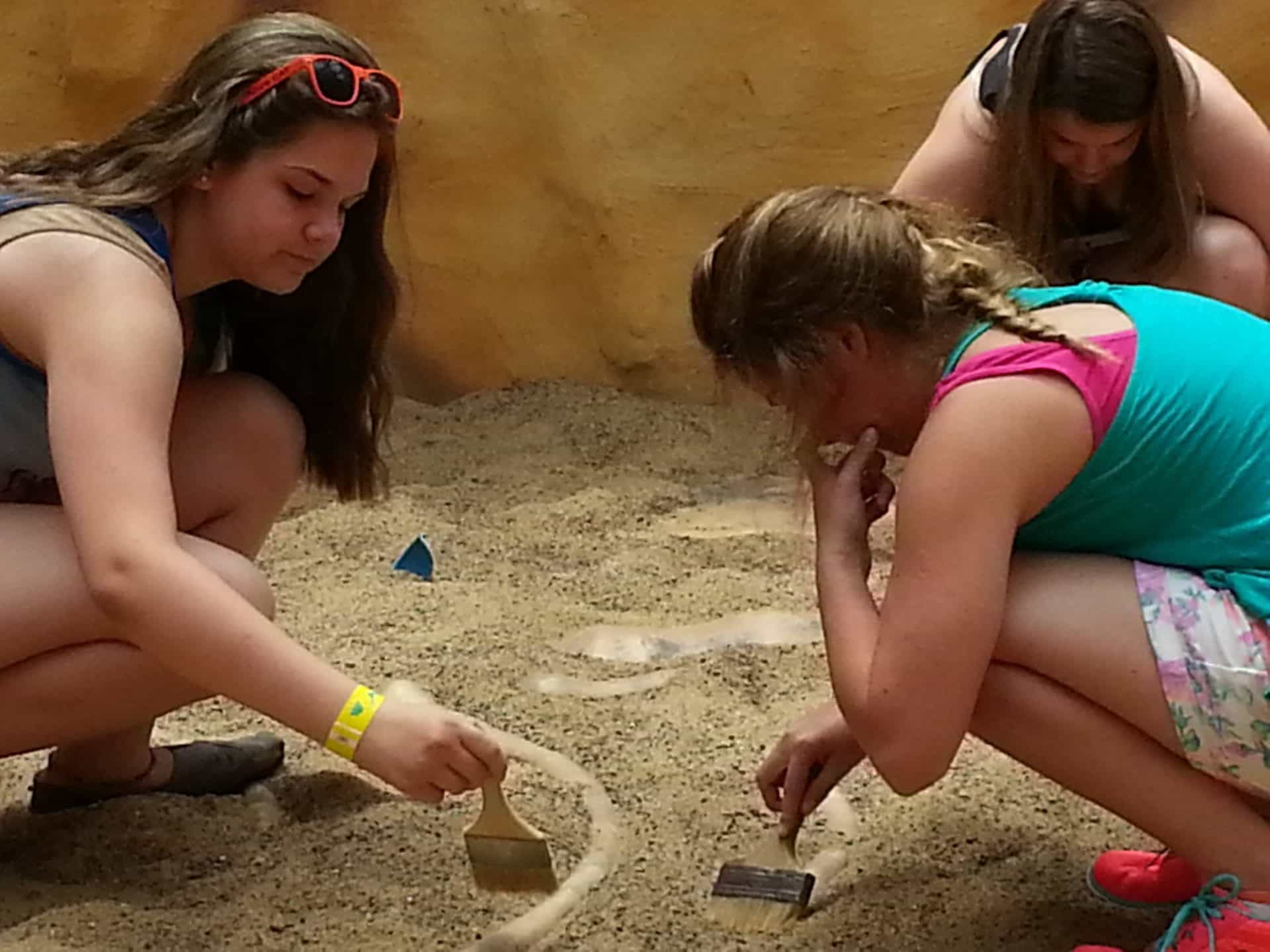 Dinosaur World girls digging in the Boneyard