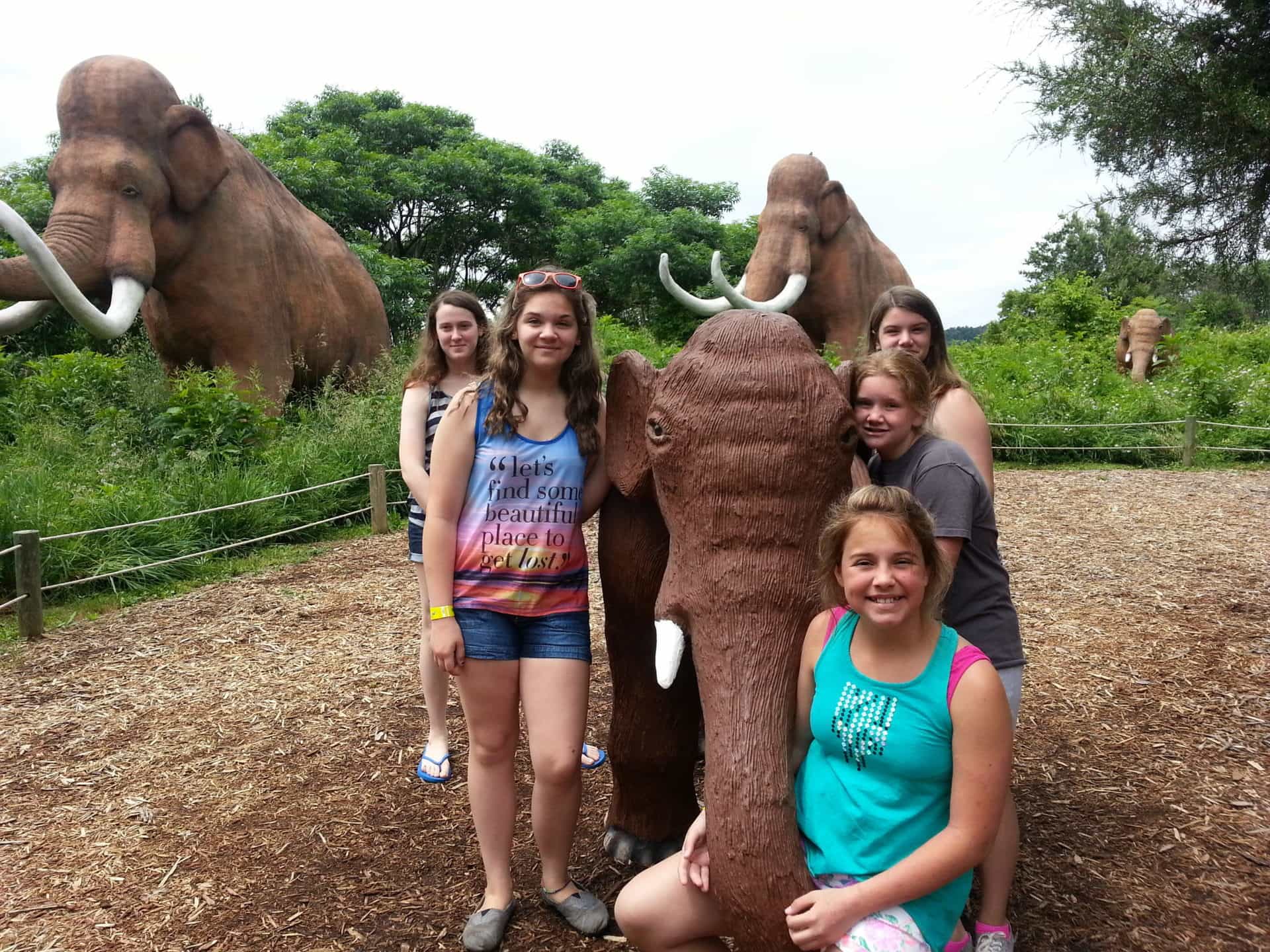 Dinosaur World posing with mammoth