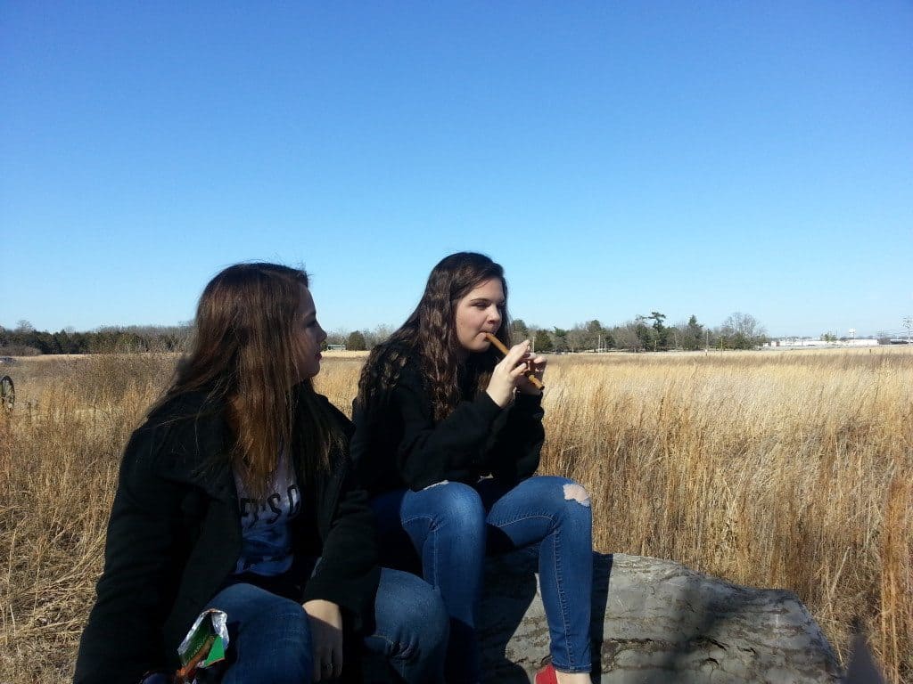 girls resting at Stones River Battlefield