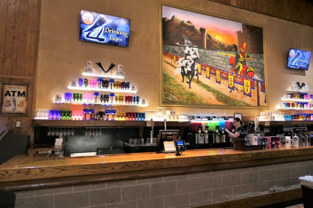 The bar with different colored smoothies in machines at Medieval Times