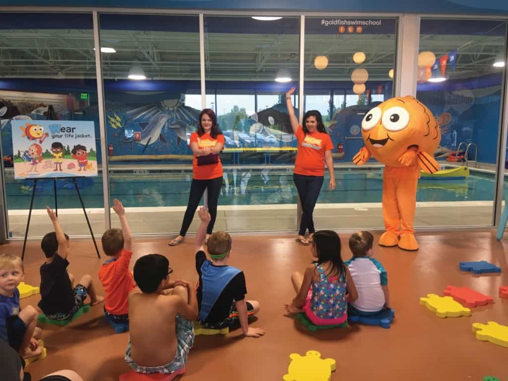Goldfish Swim School - Two teachers hosting a water safety class