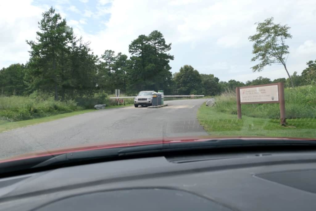 A car using the ticket card machine to enter the gate at the Elk and Bison Prairie at Land between the Lakes